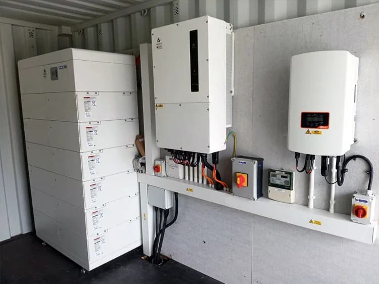 A stacked battery cabinet and two inverters installed inside a container