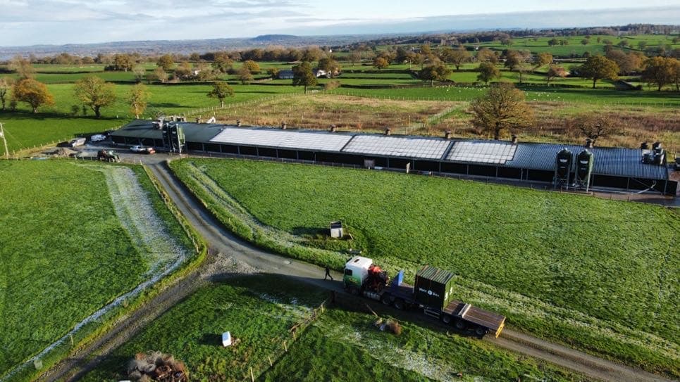 Aerial view of a shed roof covered in solar panels
